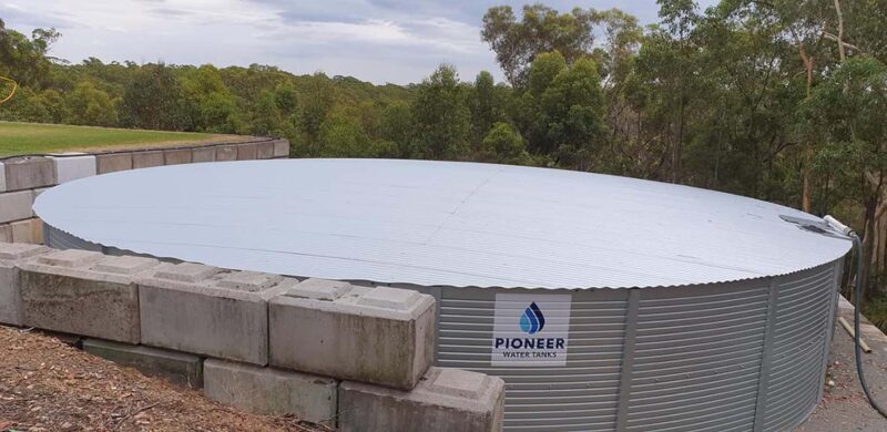 Water tank surrounded by Interlocking mortarless wall blocks